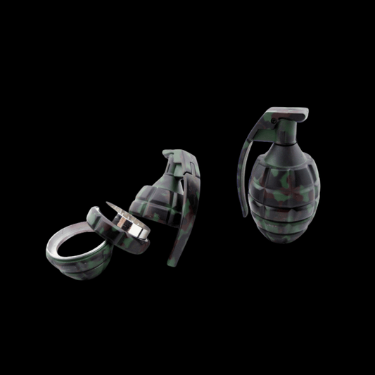 Camo grenade-style 3-part mini herb grinder, opened to show metal teeth and catch chamber