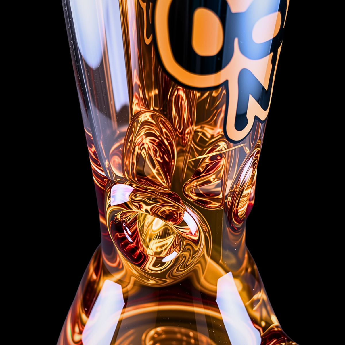 Close-up of the thick gold glass base and lower Chongz branding