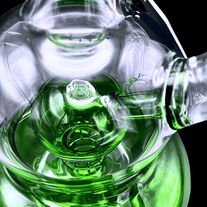 Close-up of green bubble chamber and glass bowl on Phoenix Star bong
