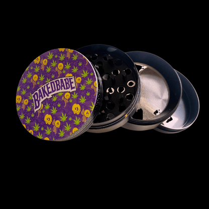 Open four-part Baked Babe metal grinder showing teeth, pollen screen and collection chamber